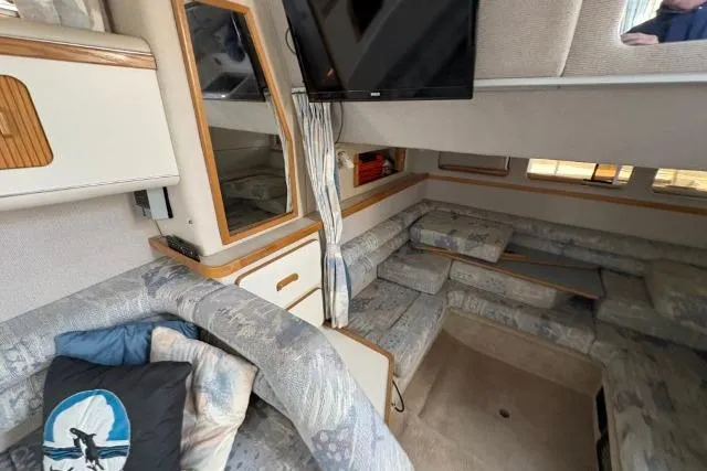 Slide: The Image of Interior of 1993 Sea Ray Sundancer 330 yacht with cozy seating and modern amenities. - 94