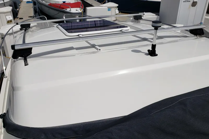 Slide: The Image of Rooftop view of a 2019 Beneteau Antares 23 boat with solar panel. - 11