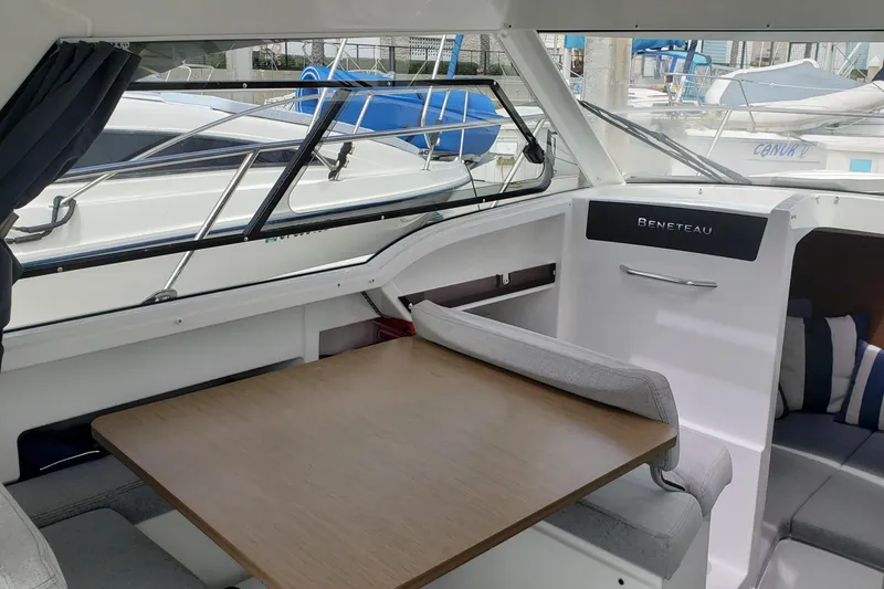 Slide: The Image of Interior of 2019 Beneteau Antares 23 boat with seating and table. - 15