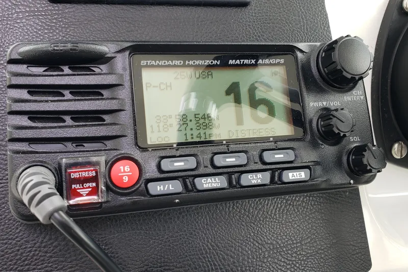 Slide: The Image of Standard Horizon Matrix AIS/GPS radio on 2019 Beneteau Antares 23 boat dashboard. - 23