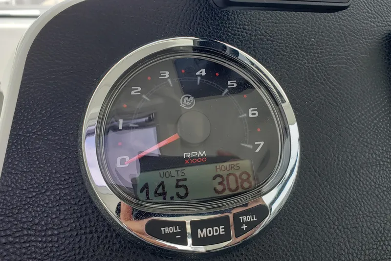 Slide: The Image of Close-up of a Beneteau Antares 23 tachometer displaying 308 hours and 14.5 volts. - 25