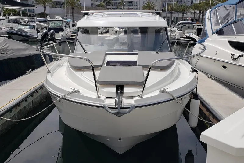 Slide: The Image of 2019 Beneteau Antares 23 boat docked at marina, front view. - 3