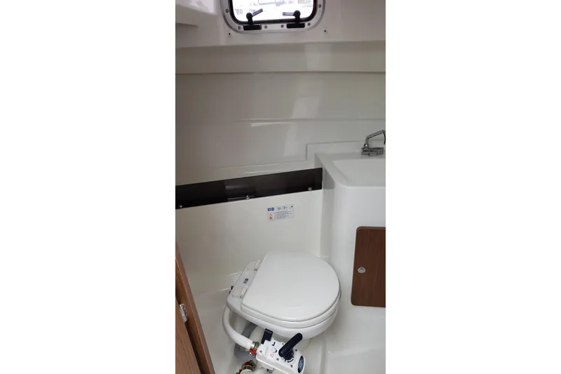 Slide: The Image of Bathroom interior of 2019 Beneteau Antares 23 boat with toilet and sink. - 32