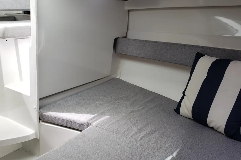 Slide: The Image of Cozy interior cabin of 2019 Beneteau Antares 23 with striped cushion. - 36