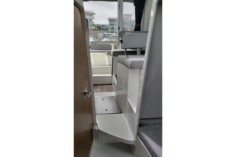 Slide: The Image of Interior view of 2019 Beneteau Antares 23 boat, featuring steps and seating area. - 37