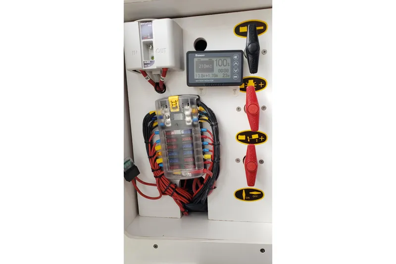 Slide: The Image of Electrical panel of a 2019 Beneteau Antares 23 boat with wiring and controls. - 38