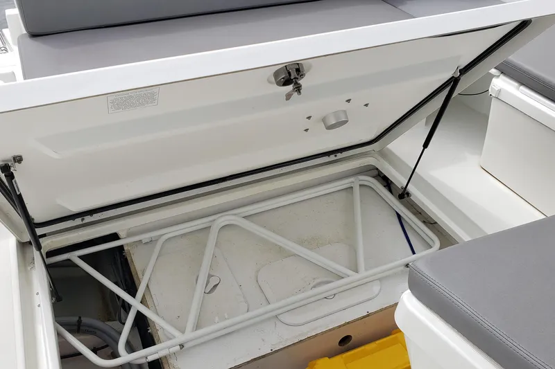 Slide: The Image of Open storage compartment on a 2019 Beneteau Antares 23 boat, showcasing interior space. - 42