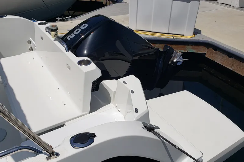 Slide: The Image of 2019 Beneteau Antares 23 boat with outboard motor at dock. - 49