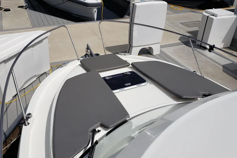 Slide: The Image of 2019 Beneteau Antares 23 boat with cushioned deck at marina. - 5