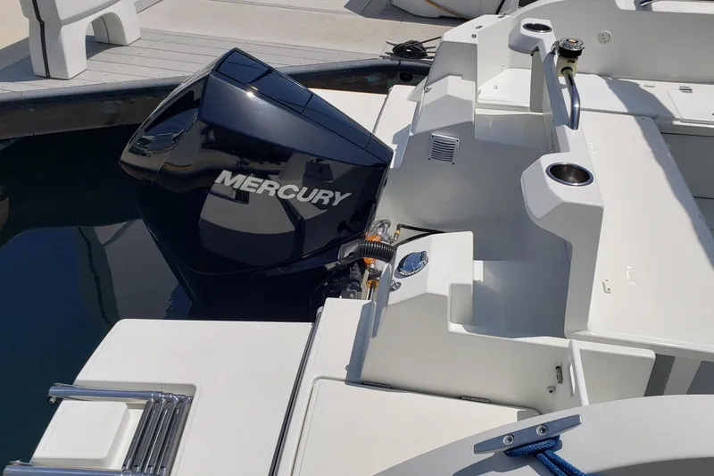 Slide: The Image of 2019 Beneteau Antares 23 with Mercury outboard engine at dock. - 50