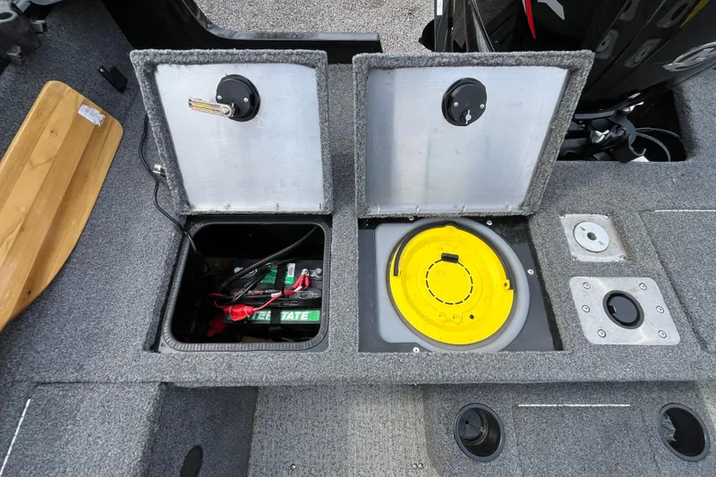 Slide: The Image of 2022 Tracker Pro Guide V-175 WT boat compartments with battery and storage. - 10