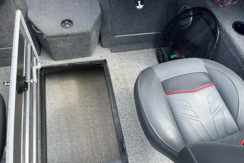 Slide: The Image of 2022 Tracker Pro Guide V-175 WT boat interior with open storage compartment and seat. - 12