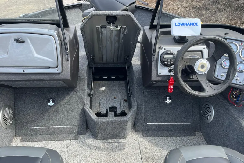 Slide: The Image of 2022 Tracker Pro Guide V-175 WT boat interior with steering wheel and Lowrance device. - 13