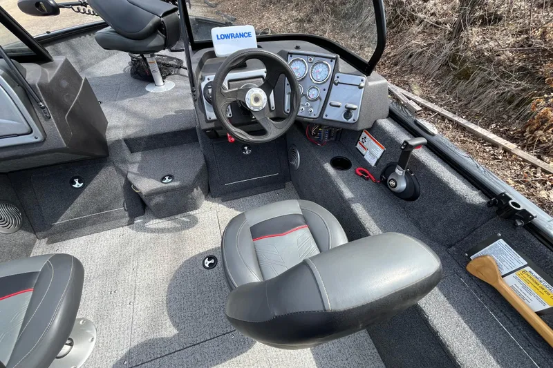 Slide: The Image of 2022 Tracker Pro Guide V-175 WT boat interior with steering wheel and seating. - 14