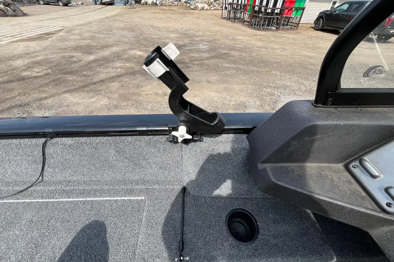 Slide: The Image of 2022 Tracker Pro Guide V-175 WT boat interior with rod holder and carpeted floor. - 15