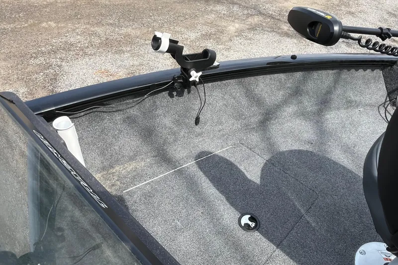 Slide: The Image of 2022 Tracker Pro Guide V-175 WT boat interior with rod holder and trolling motor. - 20