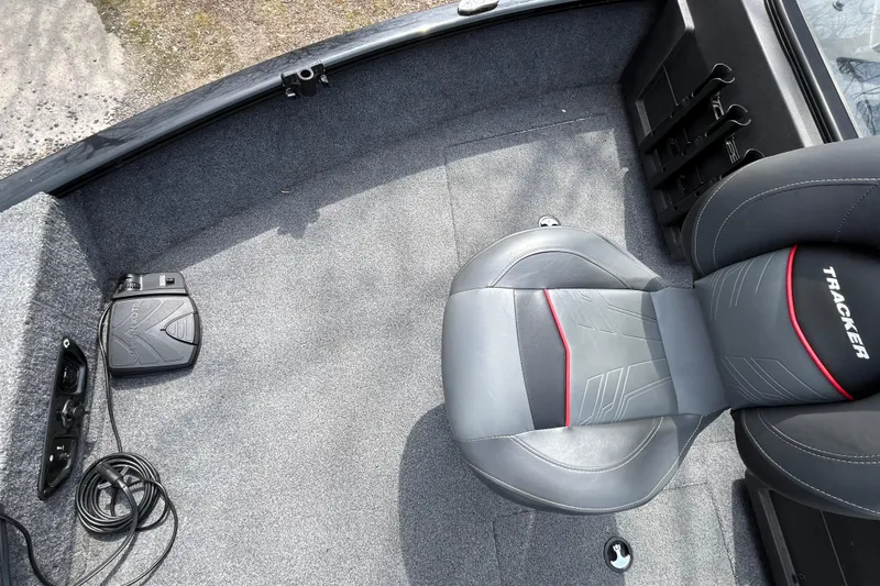 Slide: The Image of Interior of 2022 Tracker Pro Guide V-175 WT boat with gray seating and control panel. - 23