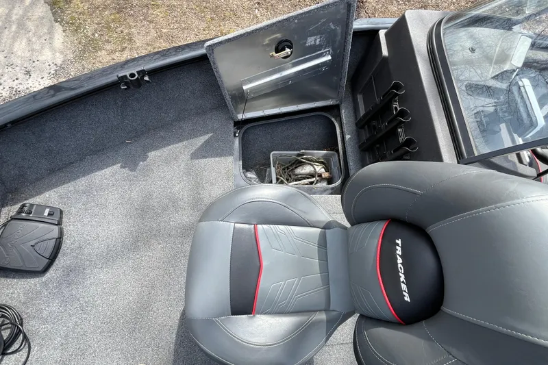 Slide: The Image of 2022 Tracker Pro Guide V-175 WT boat interior with storage compartment and seating. - 24