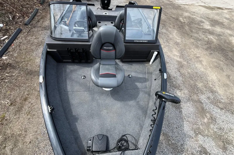 Slide: The Image of 2022 Tracker Pro Guide V-175 WT boat interior with seating and controls. - 27