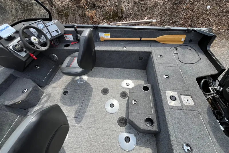 Slide: The Image of 2022 Tracker Pro Guide V-175 WT boat interior with seating and control panel. - 6