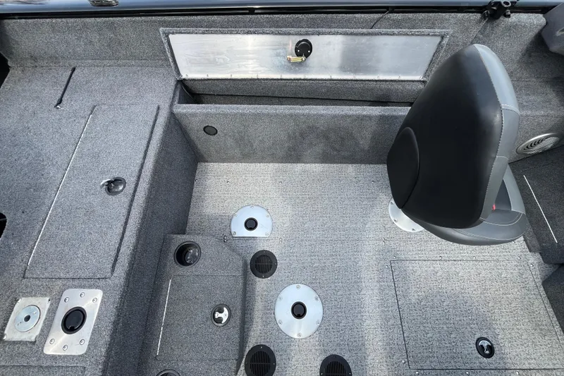 Slide: The Image of Interior of 2022 Tracker Pro Guide V-175 WT boat with seating and storage compartments. - 7