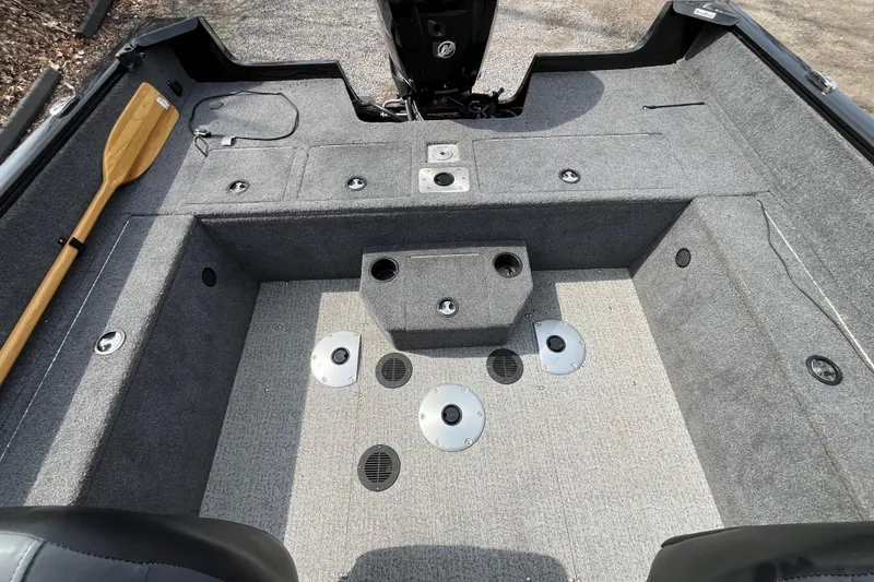 Slide: The Image of 2022 Tracker Pro Guide V-175 WT boat interior with gray carpet and storage compartments. - 8