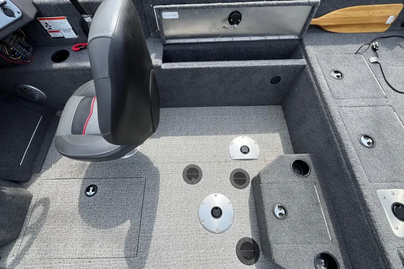 Slide: The Image of Interior of 2022 Tracker Pro Guide V-175 WT boat with seating and storage compartments. - 9