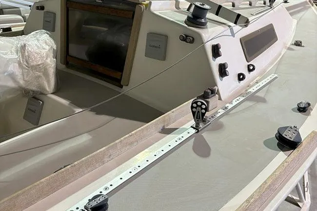 Slide: The Image of 1988 J Boats J/22 sailboat cockpit with winches and control panel. - 2