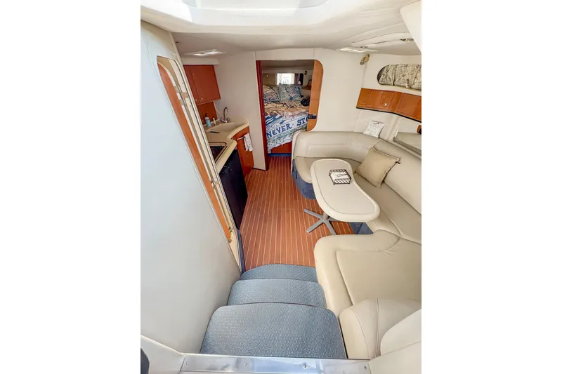 Slide: The Image of 1997 Sea Ray 370 Express Cruiser bathroom with sink, toilet, and mirror. - 23