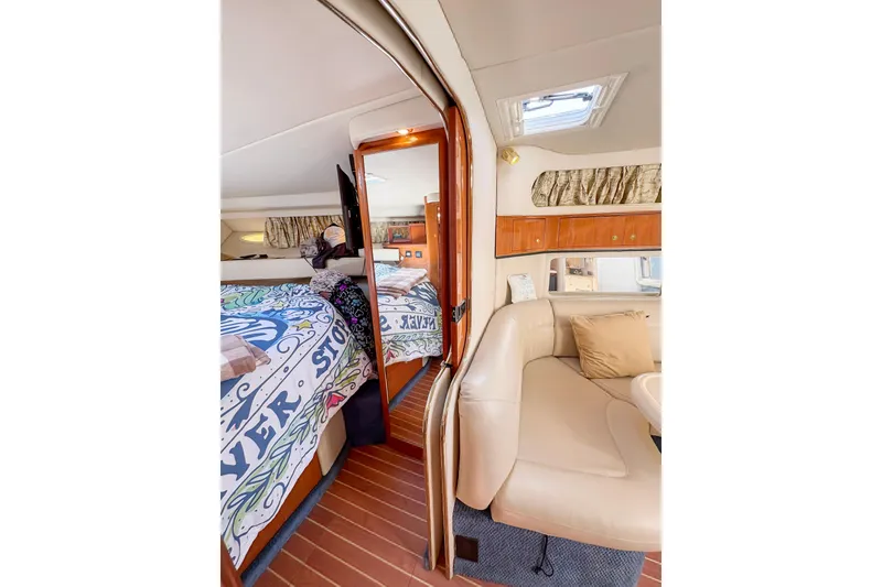 Slide: The Image of Engine compartment of a 1997 Sea Ray 370 Express Cruiser, showcasing mechanical components. - 27