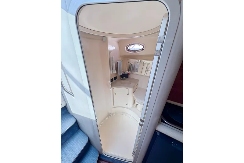 Slide: The Image of Engine room of a 1997 Sea Ray 370 Express Cruiser, showcasing mechanical components. - 28