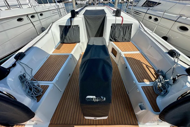 Slide: The Image of 2024 Jeanneau Sun Odyssey 410 cockpit with teak flooring and covered helm. - 103