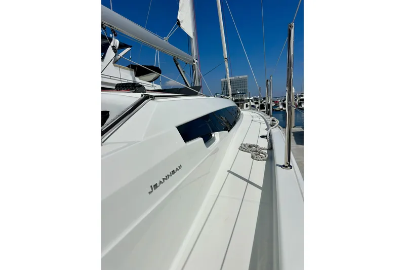 Slide: The Image of 2024 Jeanneau Sun Odyssey 410 sailboat docked, showcasing sleek design and modern features. - 30