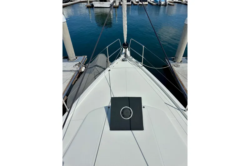 Slide: The Image of 2024 Jeanneau Sun Odyssey 410 yacht bow view at marina dock. - 32