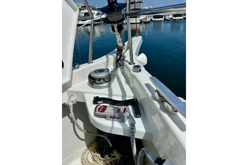 Slide: The Image of 2024 Jeanneau Sun Odyssey 410 yacht deck with winch and ropes at marina. - 33