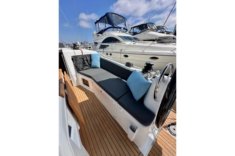 Slide: The Image of 2024 Jeanneau Sun Odyssey 410 sailboat with sleek deck and comfortable seating. - 44