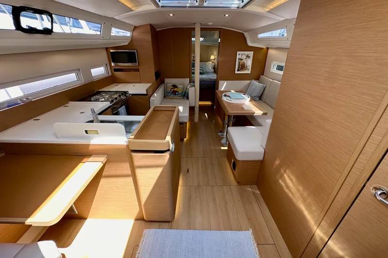 Slide: The Image of Interior of 2024 Jeanneau Sun Odyssey 410 sailboat, featuring modern wood finish and spacious layout. - 47