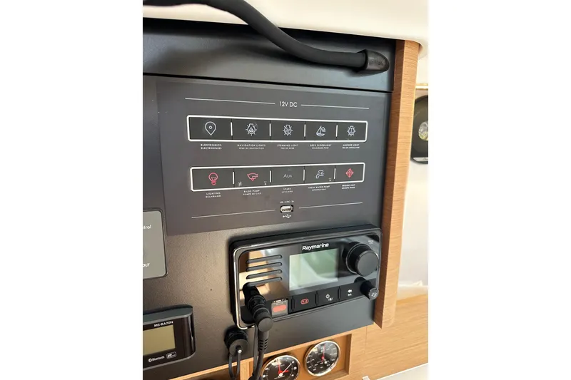 Slide: The Image of Control panel of 2024 Jeanneau Sun Odyssey 410 sailboat with navigation and electronic systems. - 53