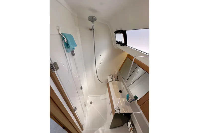 Slide: The Image of 2024 Jeanneau Sun Odyssey 410 bathroom with modern shower and sink. - 65