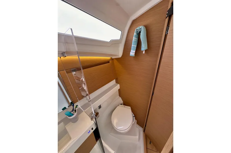 Slide: The Image of 2024 Jeanneau Sun Odyssey 410 bathroom with modern fixtures and wooden accents. - 67