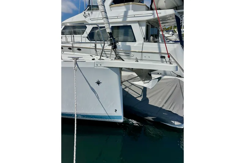 Slide: The Image of 2024 Jeanneau Sun Odyssey 410 yacht docked, showcasing sleek design and modern features. - 7