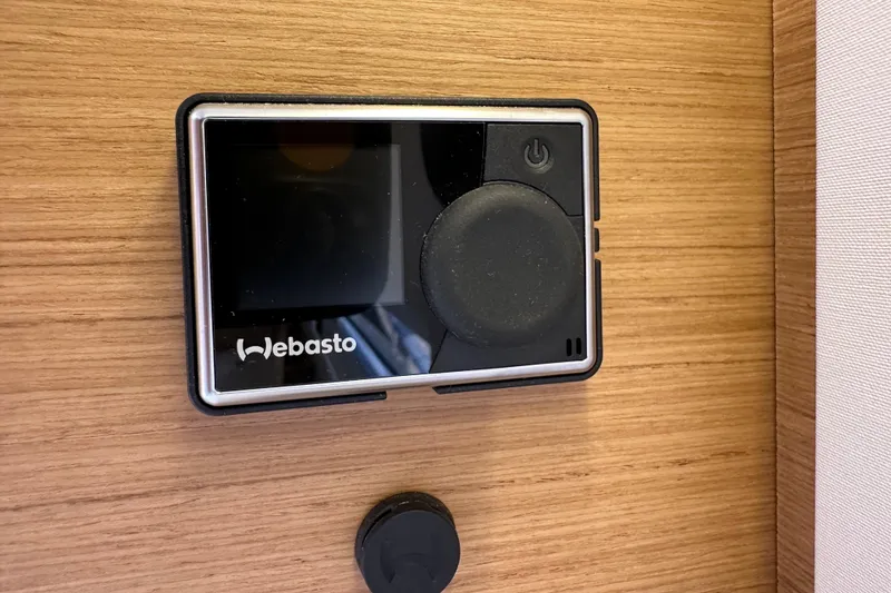 Slide: The Image of Webasto control panel on 2024 Jeanneau Sun Odyssey 410 yacht interior. - 79