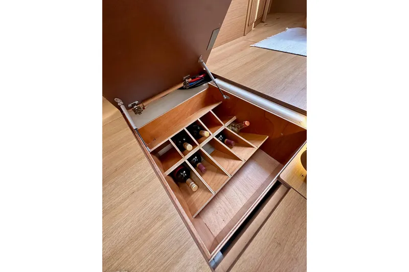 Slide: The Image of Wine storage compartment in 2024 Jeanneau Sun Odyssey 410 yacht interior. - 97