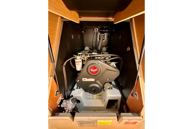 Slide: The Image of Engine compartment of 2024 Jeanneau Sun Odyssey 410 sailboat, featuring Yanmar engine. - 98