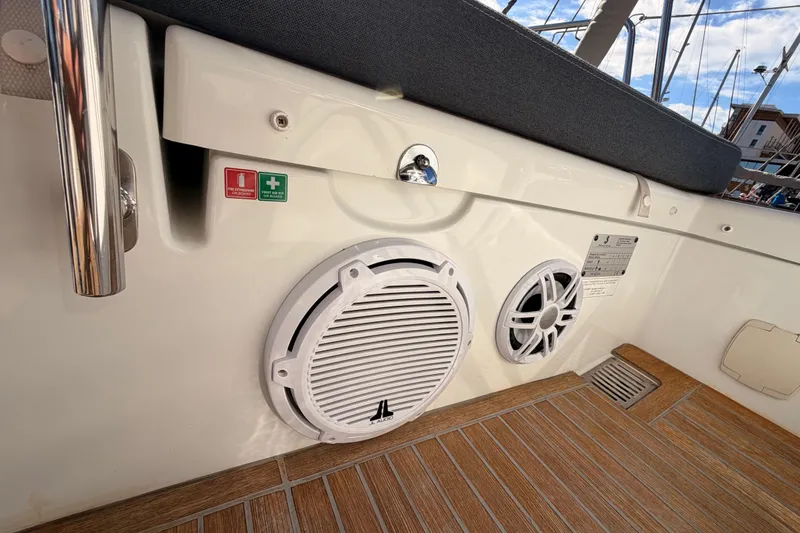 Slide: The Image of Beneteau Oceanis Yacht 60, 2015 model, deck view with speakers and safety signs. - 31