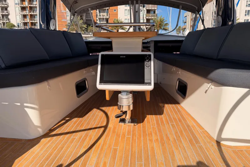 Slide: The Image of Beneteau Oceanis Yacht 60 cockpit, 2015 model, featuring sleek seating and navigation equipment. - 34