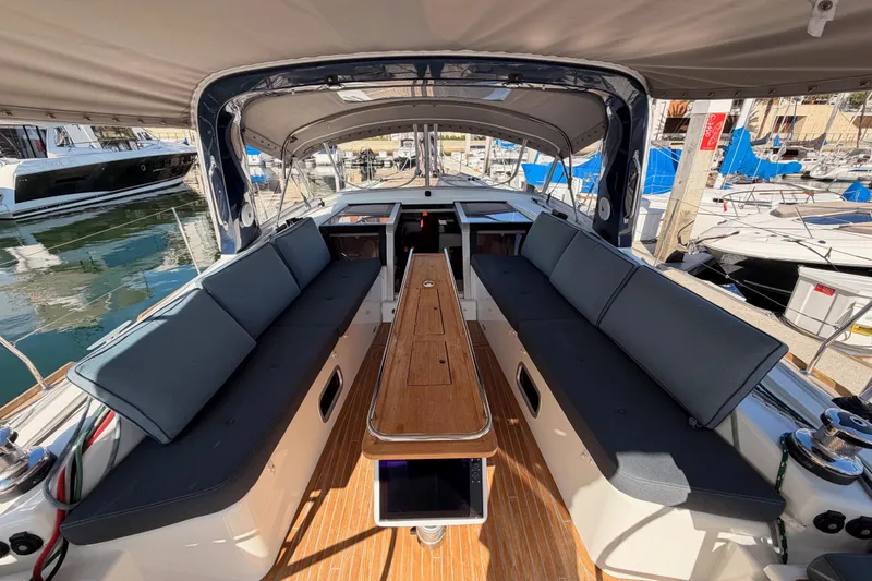 Slide: The Image of Luxurious 2015 Beneteau Oceanis Yacht 60 cockpit with elegant seating and wooden table. - 35