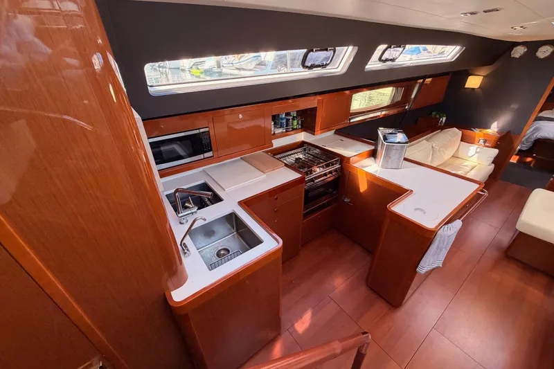 Slide: The Image of Luxurious interior of 2015 Beneteau Oceanis Yacht 60 with modern kitchen and seating area. - 38