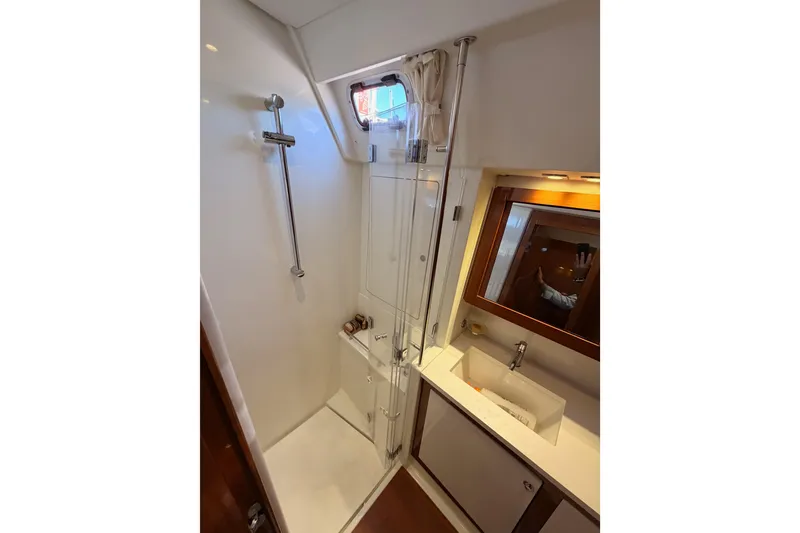 Slide: The Image of Luxurious bathroom in 2015 Beneteau Oceanis Yacht 60, featuring shower and sink. - 66
