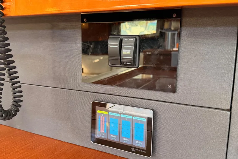 Slide: The Image of Control panel on a 2015 Beneteau Oceanis Yacht 60, featuring fuel and battery indicators. - 71